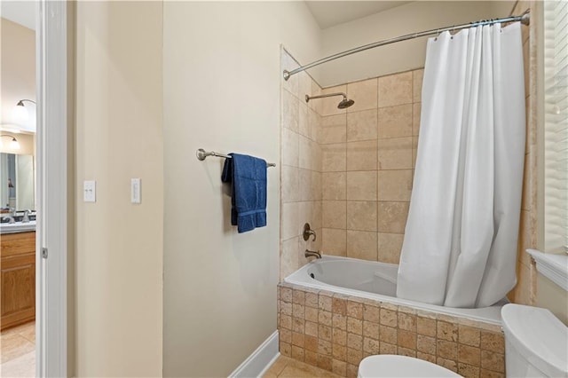 full bathroom with shower / tub combo, tile patterned flooring, vanity, and toilet