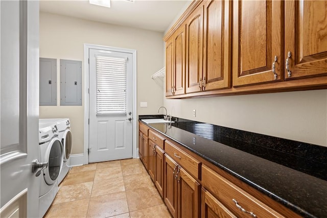 washroom with independent washer and dryer, light tile patterned floors, cabinets, electric panel, and sink