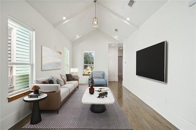 living room featuring dark hardwood / wood-style floors and high vaulted ceiling