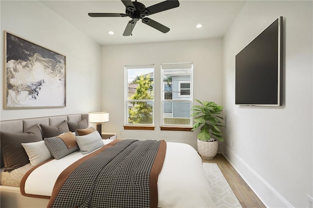 bedroom featuring light wood-type flooring and ceiling fan