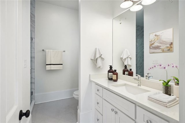 bathroom with walk in shower, vanity, and toilet