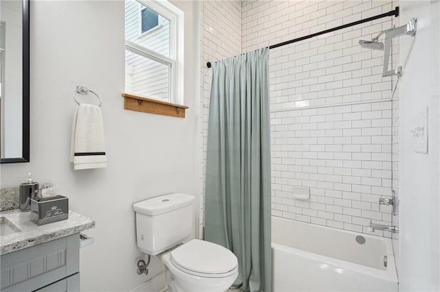 full bathroom with shower / tub combo with curtain, vanity, and toilet