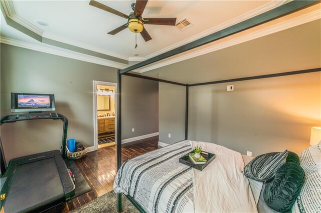 bedroom featuring crown molding, connected bathroom, dark wood-type flooring, and ceiling fan