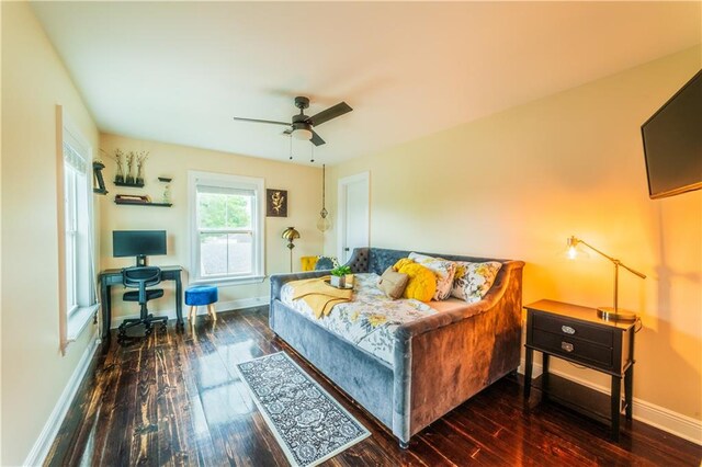 bedroom featuring ceiling fan and dark wood-type flooring