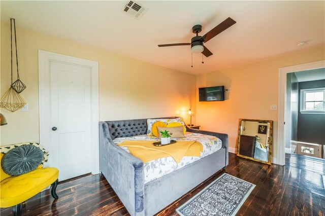 bedroom featuring dark wood-type flooring and ceiling fan