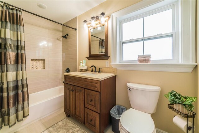 full bathroom featuring shower / tub combo, vanity, and toilet