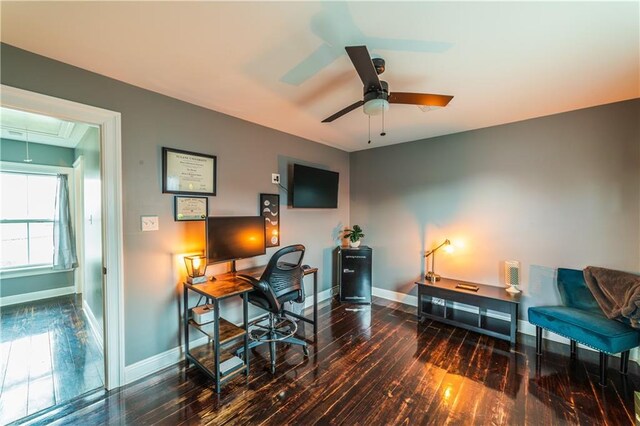 office space featuring ceiling fan and dark hardwood / wood-style flooring