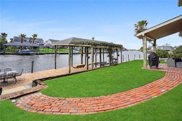 view of dock featuring a water view and a lawn