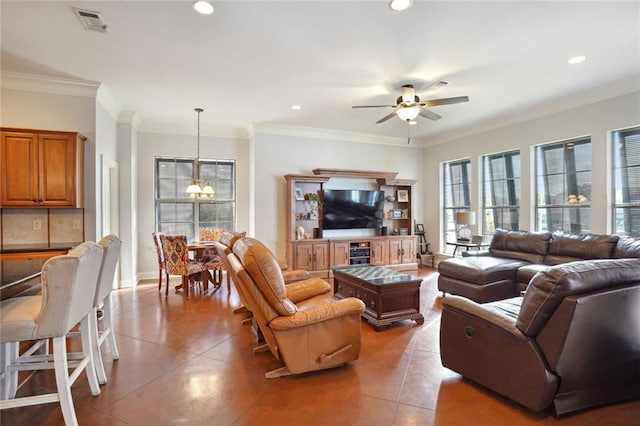 tiled living room with ornamental molding and ceiling fan