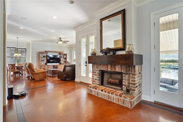 living room with a brick fireplace, crown molding, ceiling fan, and concrete flooring