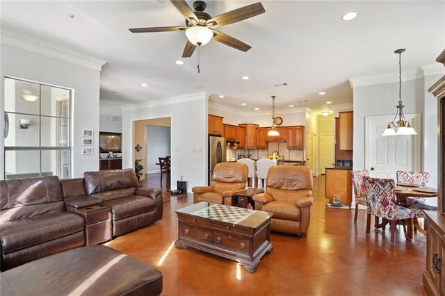 living room with ceiling fan and crown molding