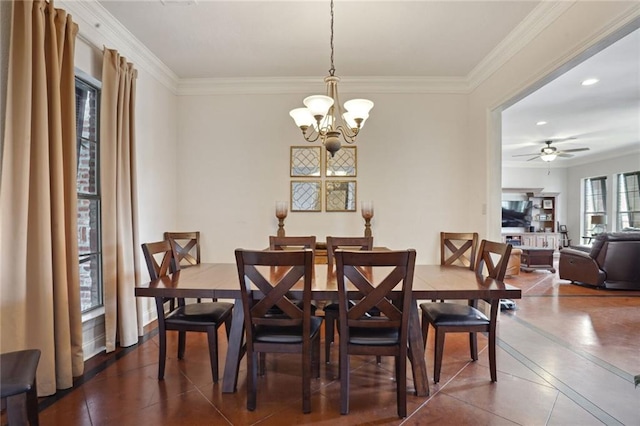 tiled dining area with ceiling fan with notable chandelier and crown molding