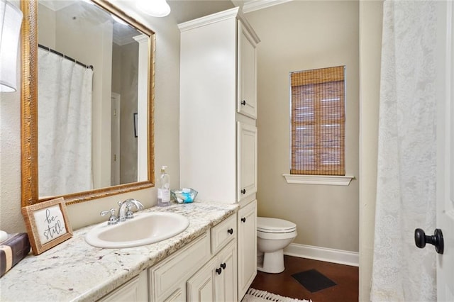 bathroom featuring wood-type flooring, vanity, and toilet