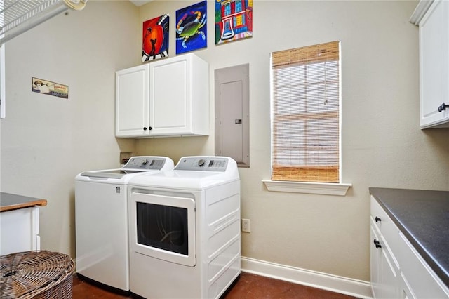 washroom featuring electric panel, plenty of natural light, independent washer and dryer, and cabinets