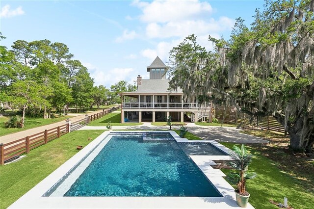 115 Holly St, Mandeville, LA 70448 - view of swimming pool featuring an in-ground hot tub and a water view