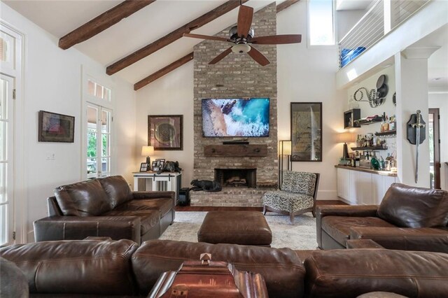 115 Holly St, Mandeville, LA 70448 - living room with a ceiling fan, high vaulted ceiling, beam ceiling, and dark wood-style flooring