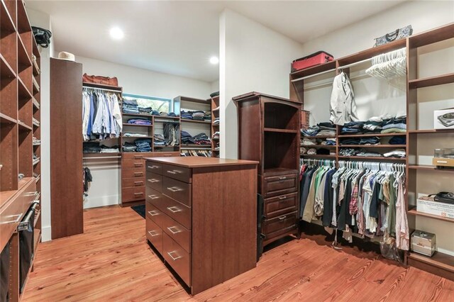 115 Holly St, Mandeville, LA 70448 - walk in closet with light wood finished floors