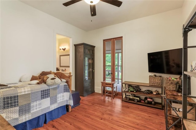 bedroom with ceiling fan and wood finished floors