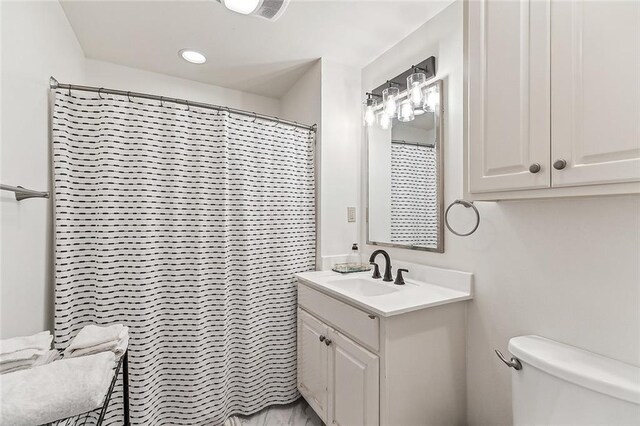 115 Holly St, Mandeville, LA 70448 - bedroom with wood finished floors, a chandelier, recessed lighting, and a desk