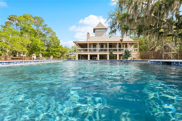 115 Holly St, Mandeville, LA 70448 - swimming pool featuring a sunroom