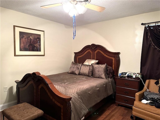 bedroom with a textured ceiling, dark hardwood / wood-style flooring, and ceiling fan