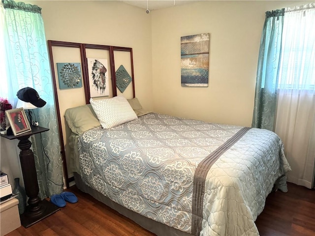 bedroom featuring dark hardwood / wood-style flooring