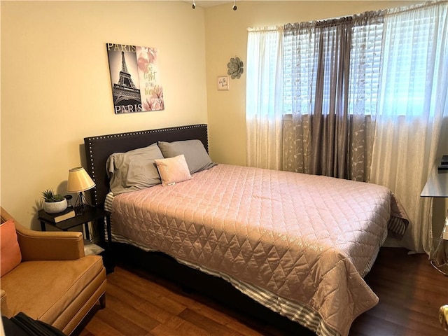 bedroom with hardwood / wood-style flooring