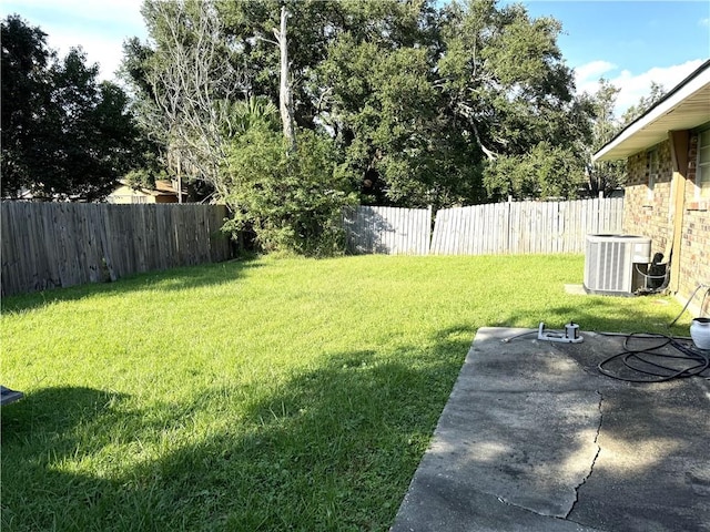 view of yard with a patio and central AC