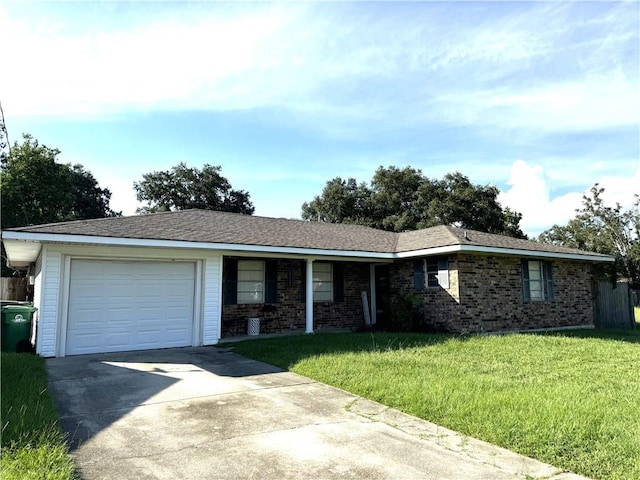 single story home featuring a garage and a front yard