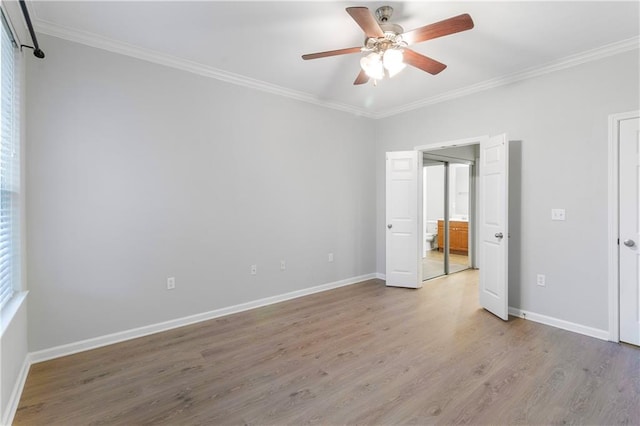 unfurnished bedroom featuring light hardwood / wood-style flooring, ceiling fan, and crown molding