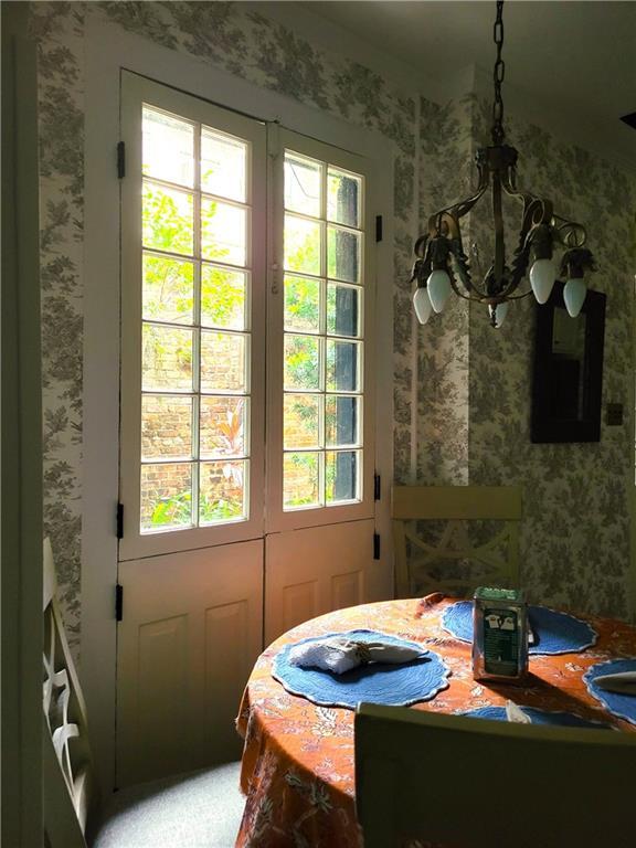 dining space with an inviting chandelier