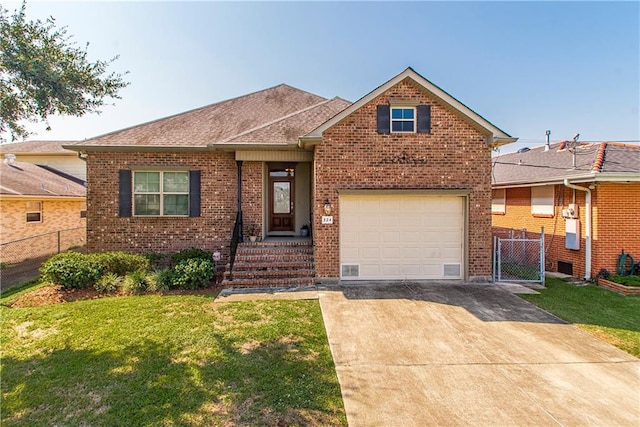 view of front of house featuring a garage and a front lawn