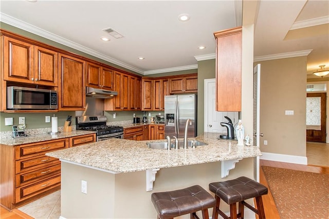 kitchen with a breakfast bar area, kitchen peninsula, stainless steel appliances, crown molding, and light stone countertops