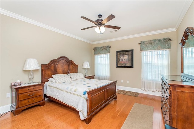 bedroom featuring multiple windows, crown molding, light hardwood / wood-style floors, and ceiling fan