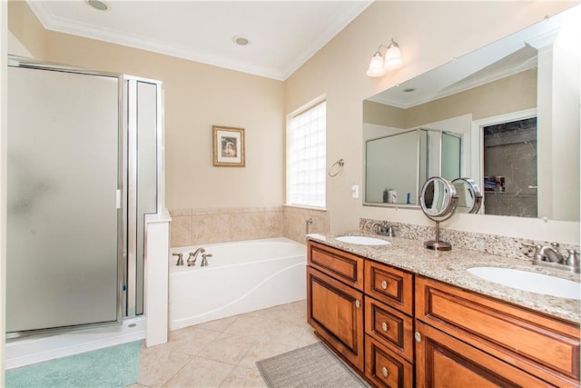 bathroom featuring ornamental molding, tile patterned flooring, independent shower and bath, and vanity