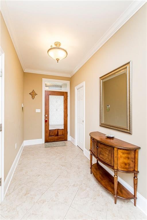 foyer featuring ornamental molding