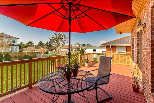 wooden deck with a yard