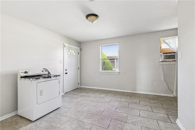 laundry area with cooling unit, washer / clothes dryer, and light tile patterned flooring