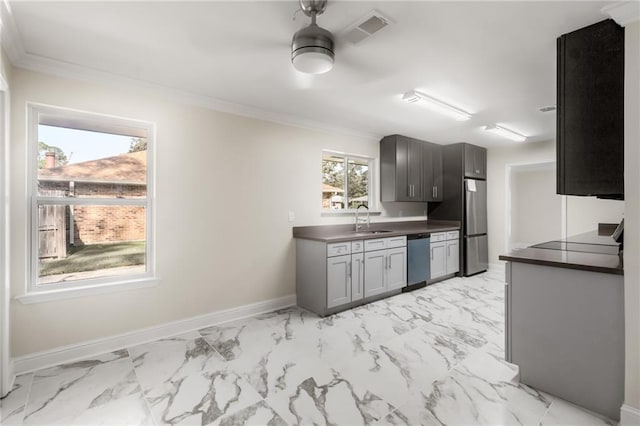 kitchen featuring gray cabinetry, crown molding, sink, and stainless steel appliances