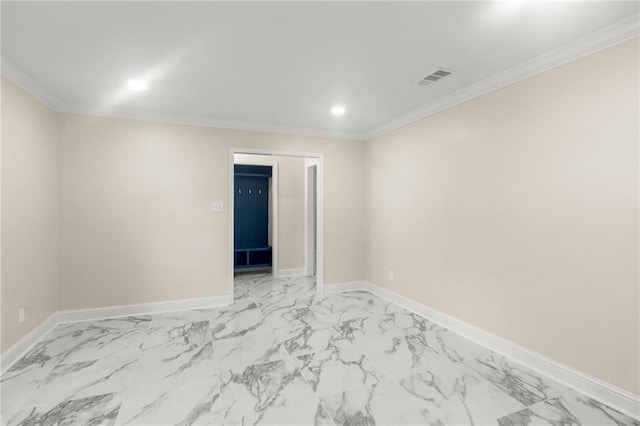 unfurnished room featuring crown molding