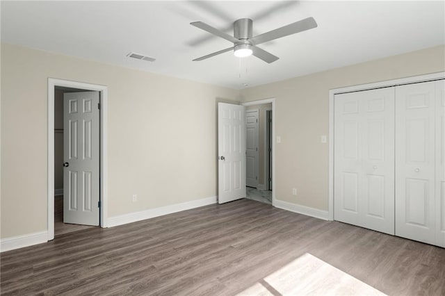 unfurnished bedroom featuring hardwood / wood-style flooring and ceiling fan