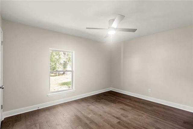 unfurnished room with ceiling fan and dark hardwood / wood-style floors