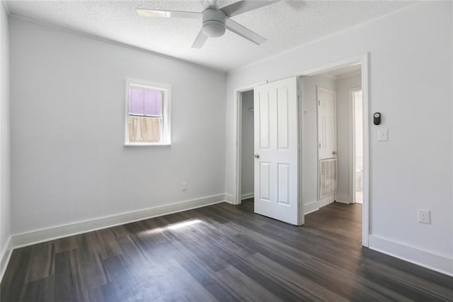 2252 N Villere St, New Orleans, LA 70117 - unfurnished bedroom featuring a textured ceiling, baseboards, a ceiling fan, and dark wood finished floors