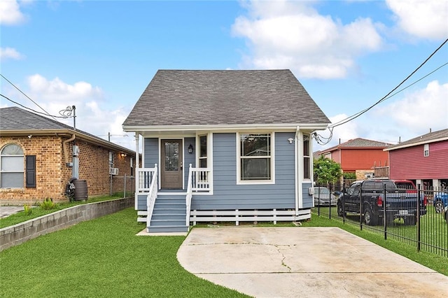 bungalow-style home with a front yard