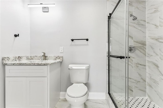 bathroom featuring vanity, an enclosed shower, and toilet