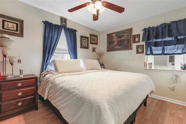 bedroom featuring light hardwood / wood-style floors and ceiling fan