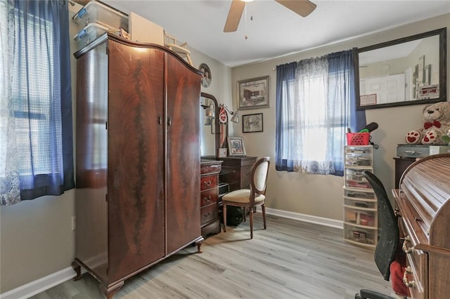 office area featuring light wood-type flooring and ceiling fan