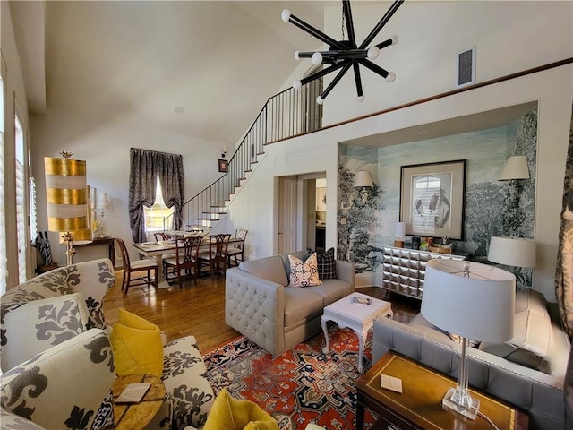 living room featuring hardwood / wood-style floors and high vaulted ceiling