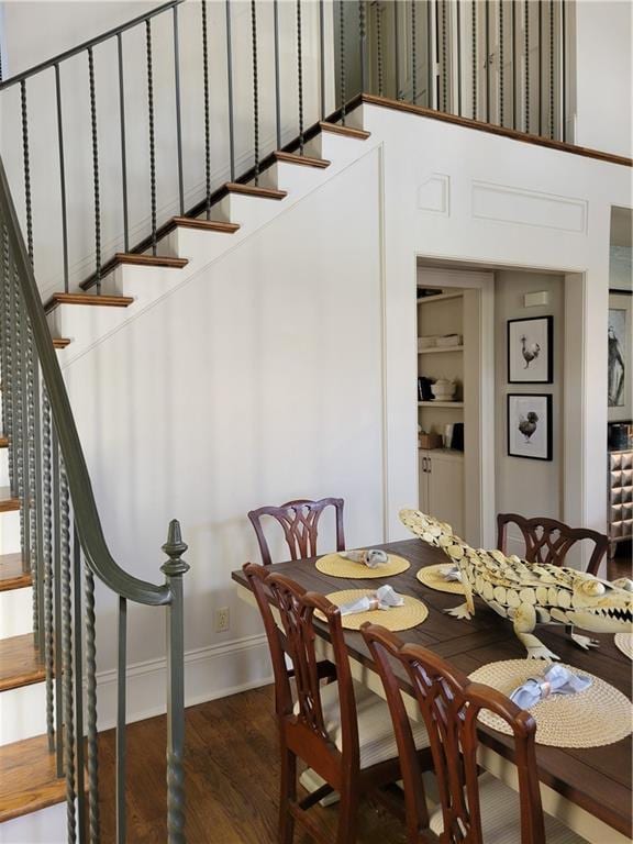 dining room with dark hardwood / wood-style flooring