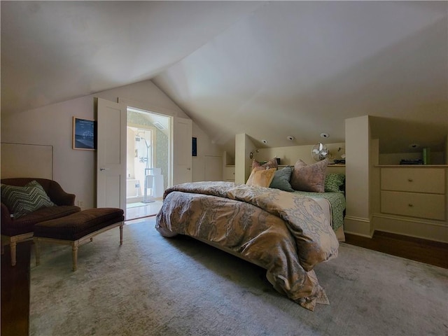 carpeted bedroom with access to outside and vaulted ceiling